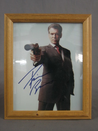 A signed colour photograph of Pierce Brosman 10" x 7"