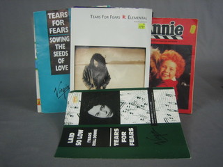 An Annie theatre programme, a collection of Tears for Fears sheet music and a Rod Stewart book