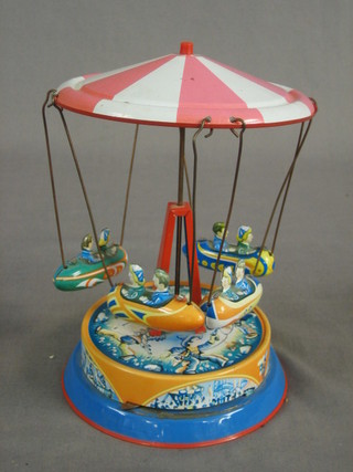 A tin plate clockwork carousel