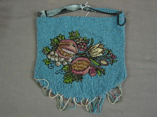 A turquoise bead work evening bag