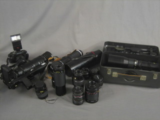 A Zenith camera together with a very large lens and a collection of various photographic equipment
