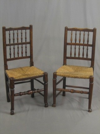 A set of 4 19th Century elm spindle back dining chairs with woven rush seats