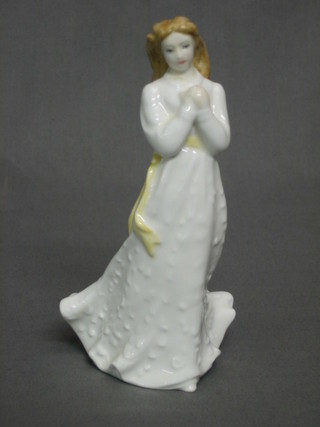 A Royal Doulton figure - Standing lady in a white dress 6"