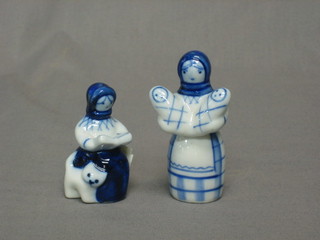 A Soviet Russian porcelain figure of a mother with 2 babies 3" and 1 other in the form of a seated lady reading a book with cat 2 1/2"