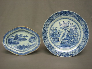 An Oriental blue and white porcelain shaped dish decorated Pagodas 9" and an Oriental blue and white porcelain dish, the reverse with seal mark decorated birds 11"