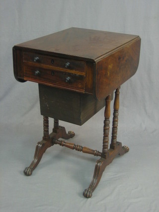 A 19th Century drop flap work table, fitted 2 drawers above a basket, raised on ring turned supports 17"