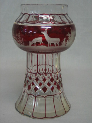 A Bohemian red overlay glass thistle shaped oil lamp base decorated windmill and buildings (chip to base) 10"