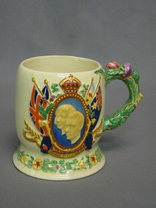 A Crown Devon musical pottery mug (base chipped)