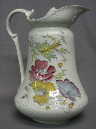 A pottery ewer with floral decoration 12"