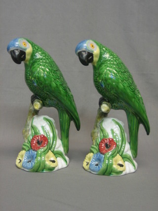 A pair of Portuguese pottery figures of seated parrots 11"