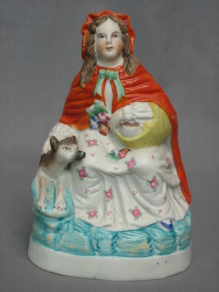 A 9th Century biscuit porcelain figure of Little Red Riding Hood 8"