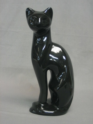 A black glazed pottery figure of a seated cat 11"