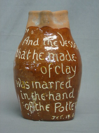 A  Victorian  pottery motto jug, the reverse marked Horace Elliot, London 1891, the verse reads - And the vessel that he made of clay was marred in the hand of the potter, 11"