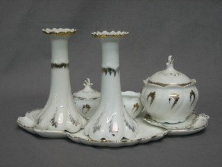 A 7 piece dressing table set comprising scallop shaped tray, pair of candlesticks, pair of circular jars and covers (1 lid missing), pin tray, circular jar and cover