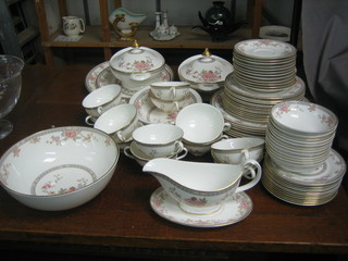 An 81 piece Royal Doulton Canton pattern dinner service comprising 2 graduated oval meat plates, 2 oval dishes 11", 3 oval twin handled tureens and covers 10", circular bowl 10", sauce boat and stand, 12 twin handled soup bowls and saucers, 12 dinner plates 11", 12 side plates 8", 12 tea plates 7", 12 pudding bowls 5 1/2"