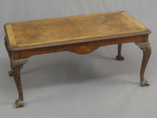 A 1920's Queen Anne style rectangular walnut coffee table, raised on cabriole supports 42"