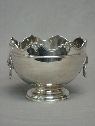 A circular silver twin handled rose bowl with wavy border and lion mask handle, raised on a circular spreading foot, Chester 1910, 12 ozs