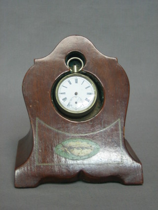 A mahogany watch stand possible made from an aircraft propeller, containing an open faced pocket watch