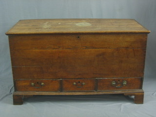 An 18th Century elm mule chest with hinged lid, the base fitted 3 drawers raised on bracket feet 48"