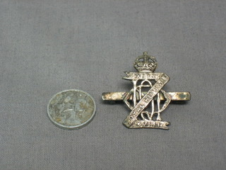 A miniature British War medal, the obverse marked War Medal 1914-18 together with a Royal Husaars sweetheart brooch