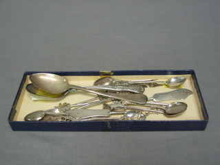A silver teaspoon, 6 Eastern silver teaspoons, 4 Eastern silver butter knives, 6 Eastern silver Eastern cocktail sticks 4 ozs, a silver plated Queens pattern spoons and souvenir spoon