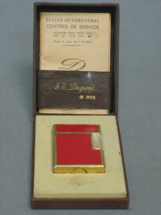 A red enamel Dupont lighter