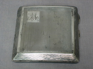 An Art Deco silver cigarette case, Chester 1927 with engine turned decoration 2 ozs