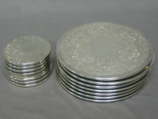 7 circular silver plated place mats 7" and 8 coasters 3 1/2"