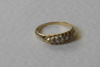 A gold dress ring set 5 small diamonds