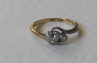 An 18ct gold dress ring set 3 diamonds