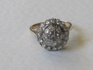 An 18ct gold cluster ring set numerous diamonds