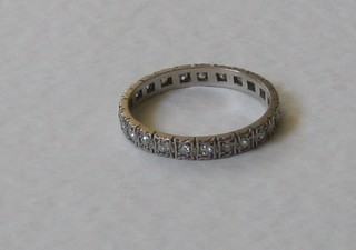 A lady's gold fully eternity ring set diamonds