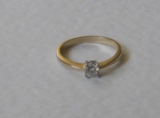 A yellow gold dress ring set a solitaire diamond