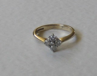 A 9ct gold dress ring set 5 diamonds
