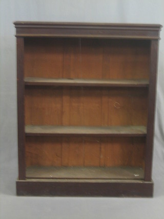 A Victorian mahogany bookcase fitted adjustable shelves, raised on a platform base 34"