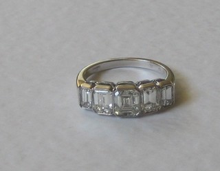 A lady's 18ct white gold engagement/dress ring set 5 square cut diamonds, approx 2.45ct