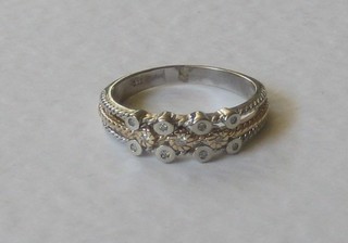 An 18ct white and yellow gold dress ring set diamonds