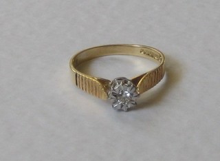 An 18ct yellow gold dress ring set a solitaire diamond