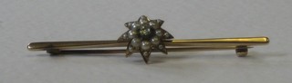 A gold bar brooch with star decoration set a diamond and pearls