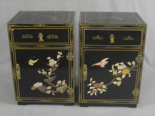 A pair of 20th Century Chinese lacquered bedside cabinets fitted a drawer above a cupboard inlaid with hardstones 16", complete with a certificate of authenticity