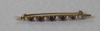 An Edwardian 14ct gold bar brooch set amethysts and pearls