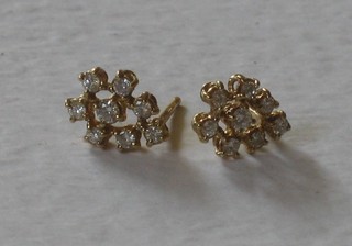 A pair of 18ct yellow gold and diamond set earrings 220-250