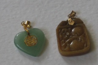 An Eastern hardstone pendant and 1 other