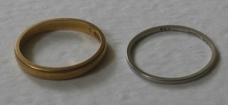 A 22ct gold wedding band and 1 other wedding band