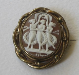 A 19th Century shell carved cameo brooch decorated The Three Graces, contained in a pinch beck mount