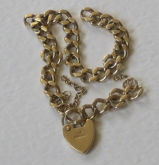 A gilt metal curb link bracelet with 9ct gold heart shaped padlock (f)