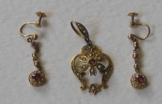 A 9ct pierced gold pendant set demi-pearls together with a pair of earrings set red stones and demi-pearls