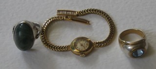 2 heavy silver dress rings and a lady's wristwatch in a gilt case
