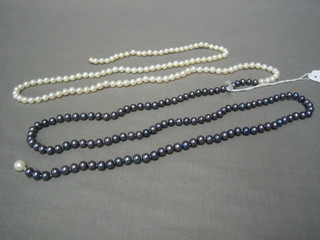 A rope of black and white fresh water pearls