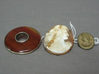 A Victorian shell carved cameo portrait brooch, a lava brooch and a circular agate brooch